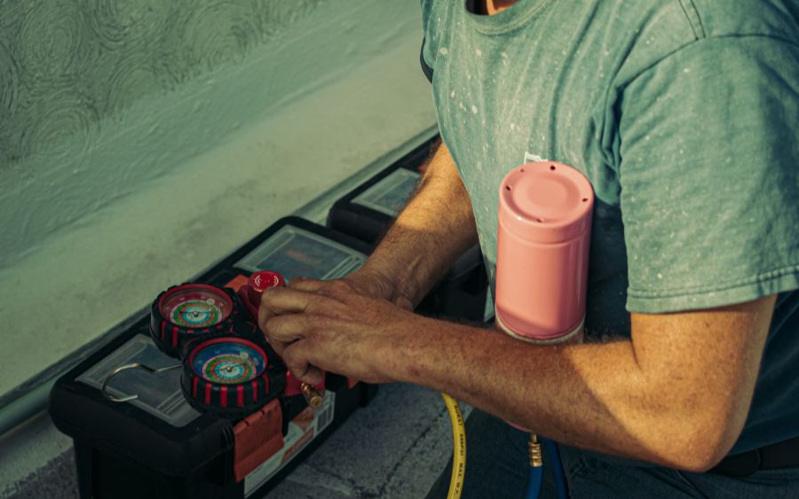 Technician testing a heating system with a multimeter